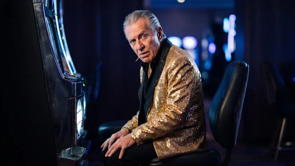 Slot RTP versions explained: Chip turns from a slot machine on the casino floor